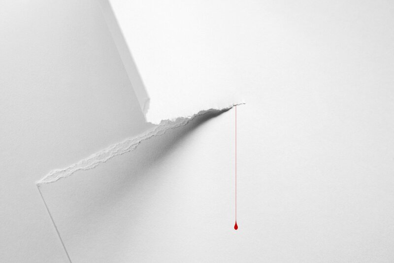 Torn Paper with Blood Drop