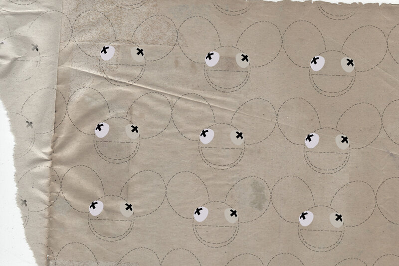 torn paper with cartoon faces
