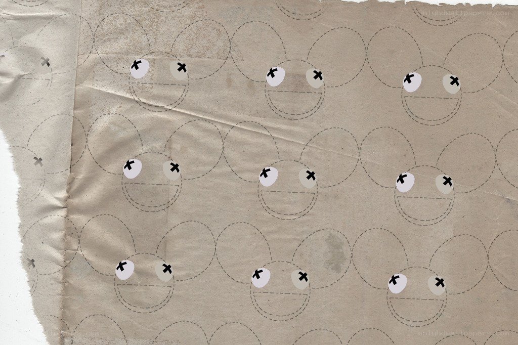 torn paper with cartoon faces