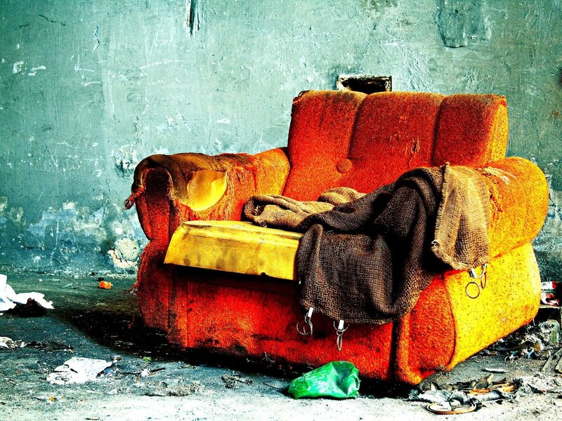 Torn Red Armchair