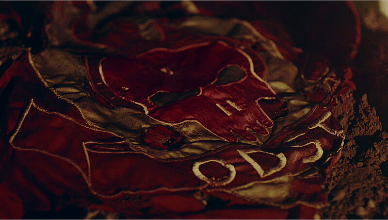 torn red fabric with skull design
