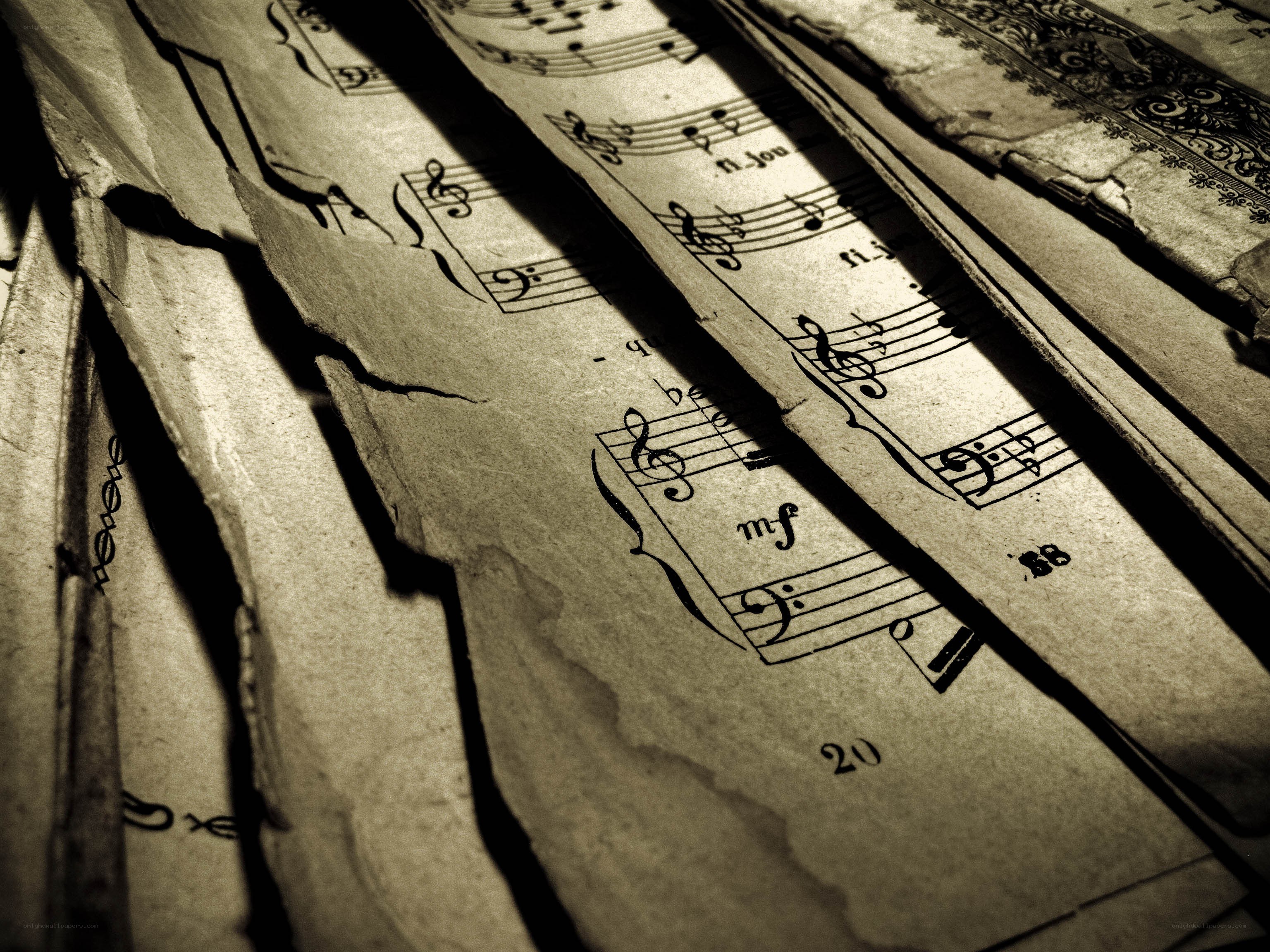 torn sheet music pages