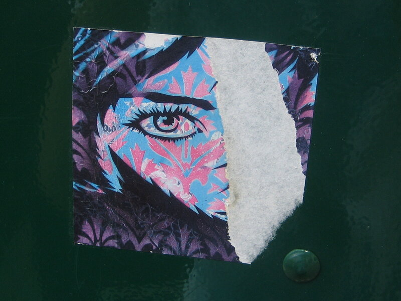 torn sticker with eye art