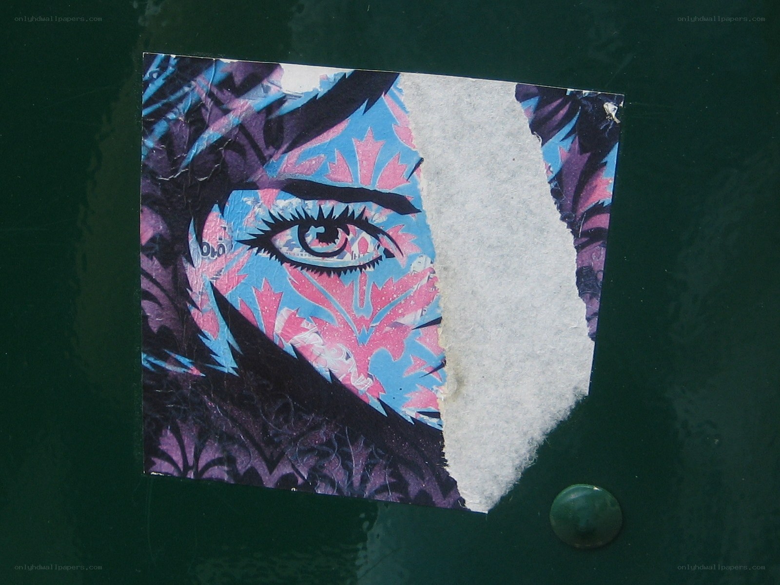 torn sticker with eye art