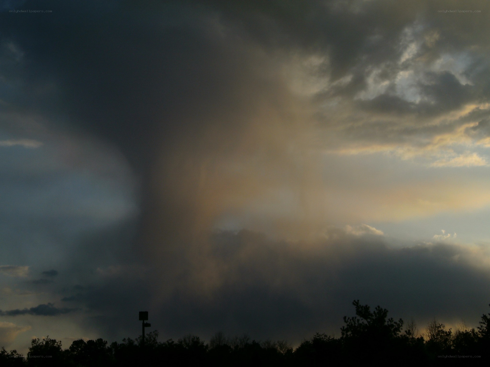 Tornado funnel cloud at dusk