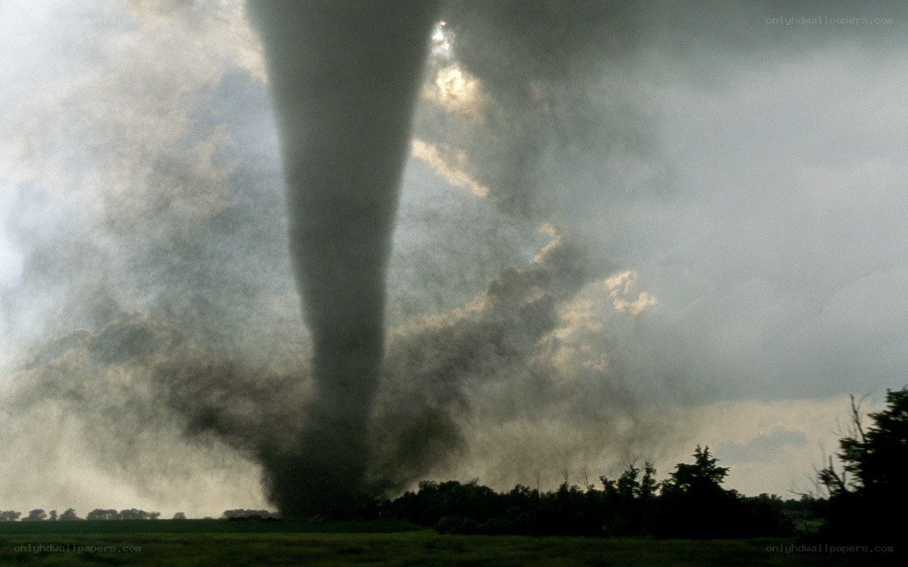 Tornado over a rural landscape