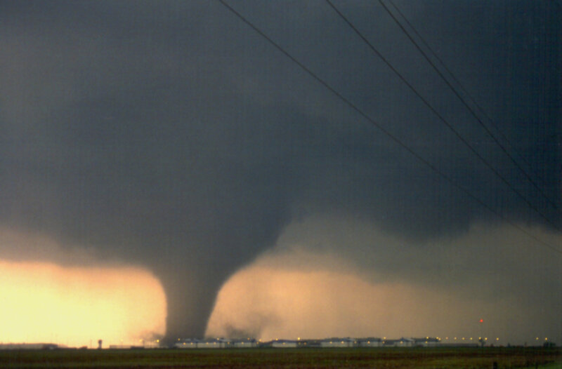 Tornado over a rural landscape