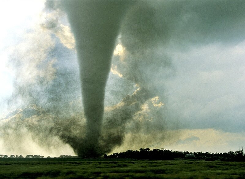 Tornado over a rural landscape