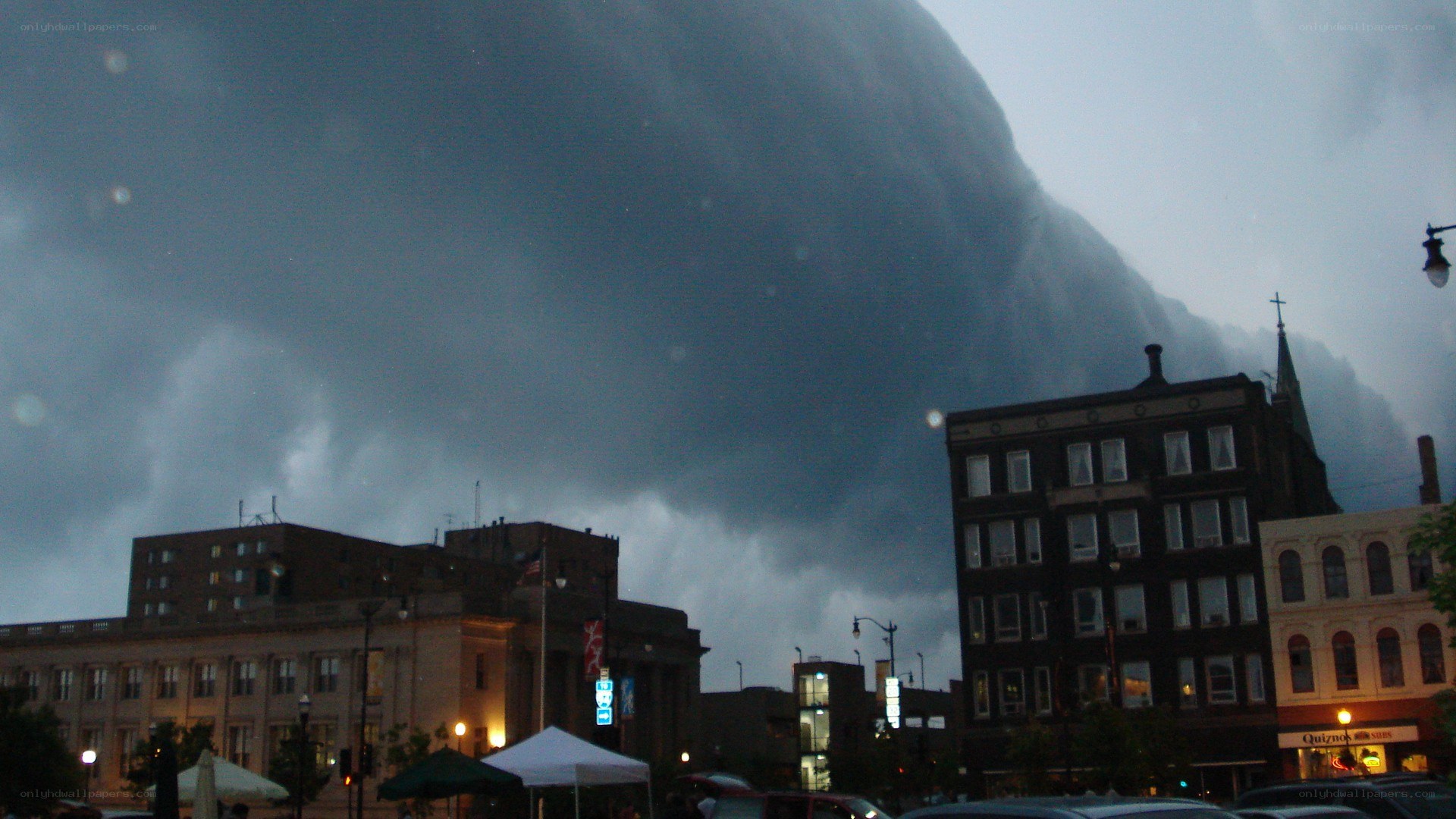 Tornado over city skyline