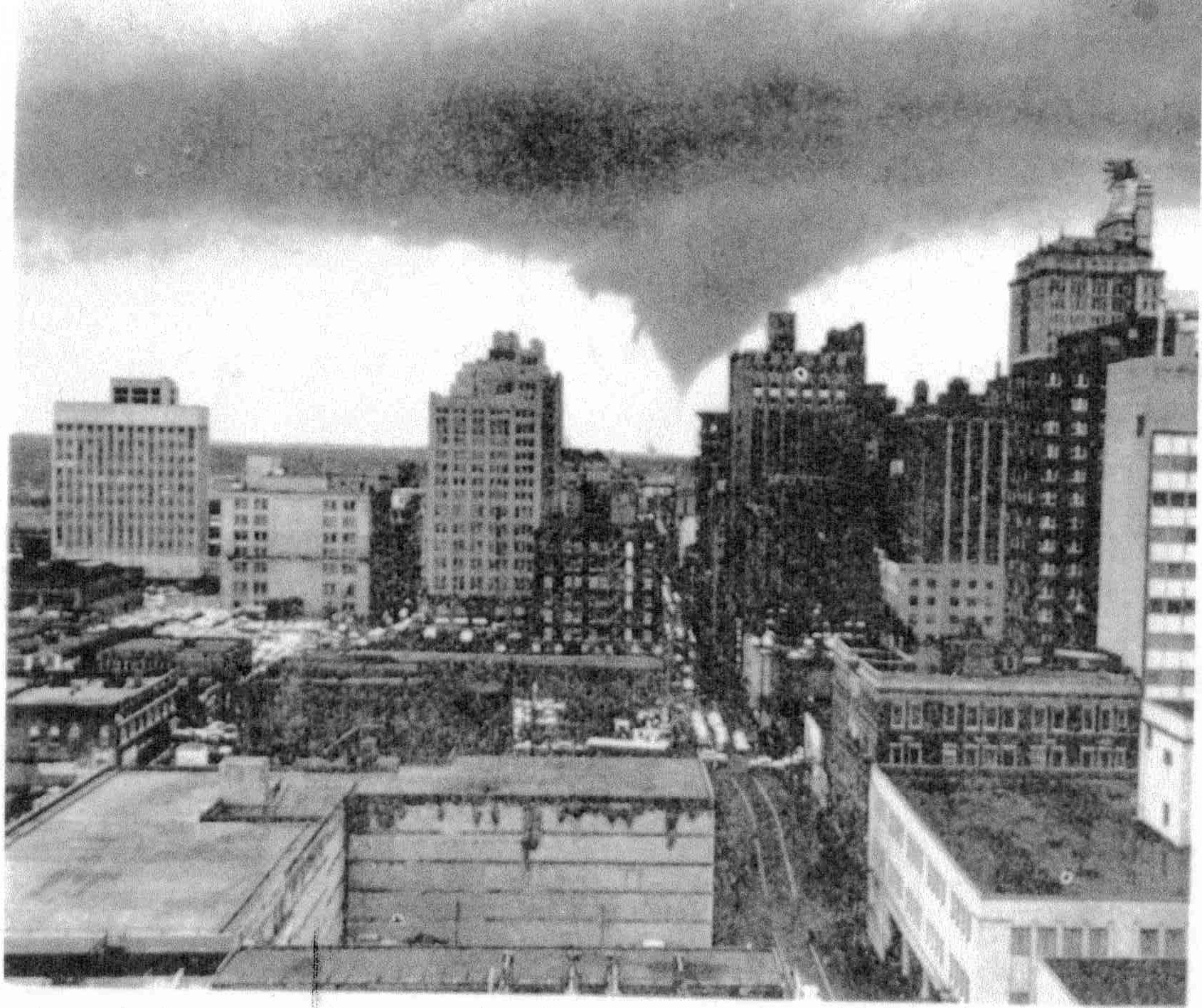Tornado over city skyline