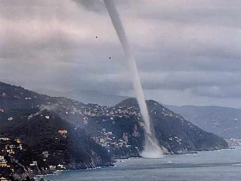 Tornado over coastal town