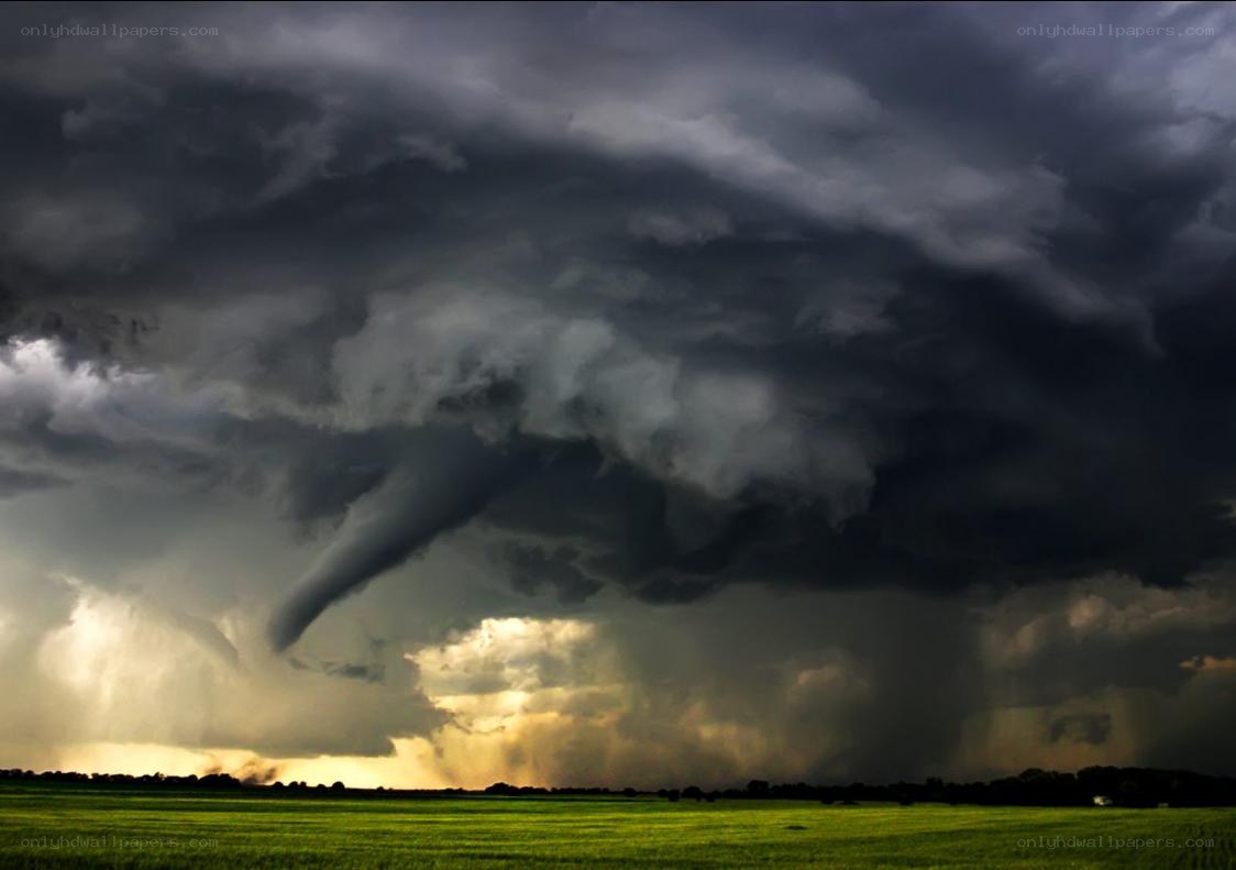 Tornado over green fields