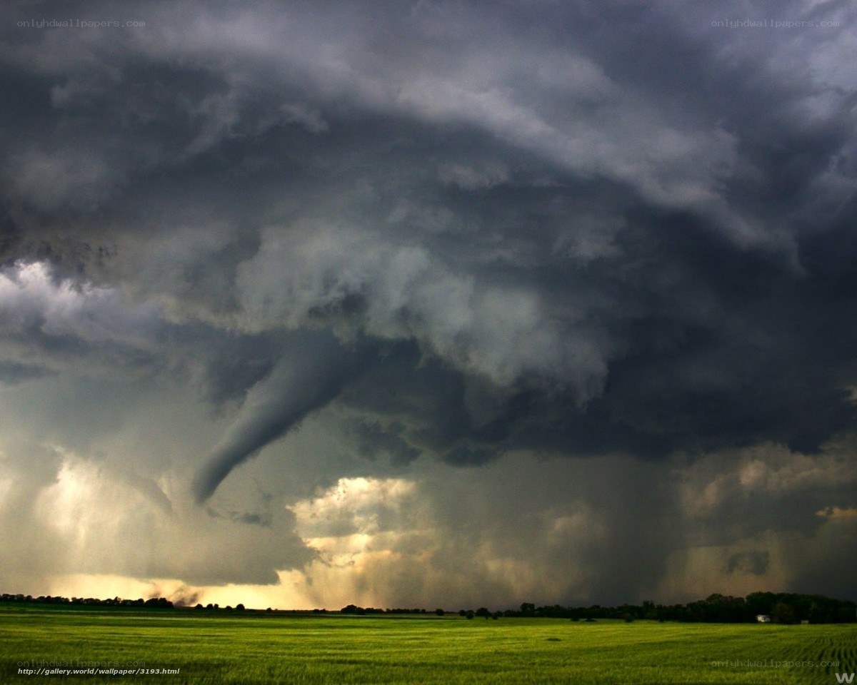 Tornado over green fields