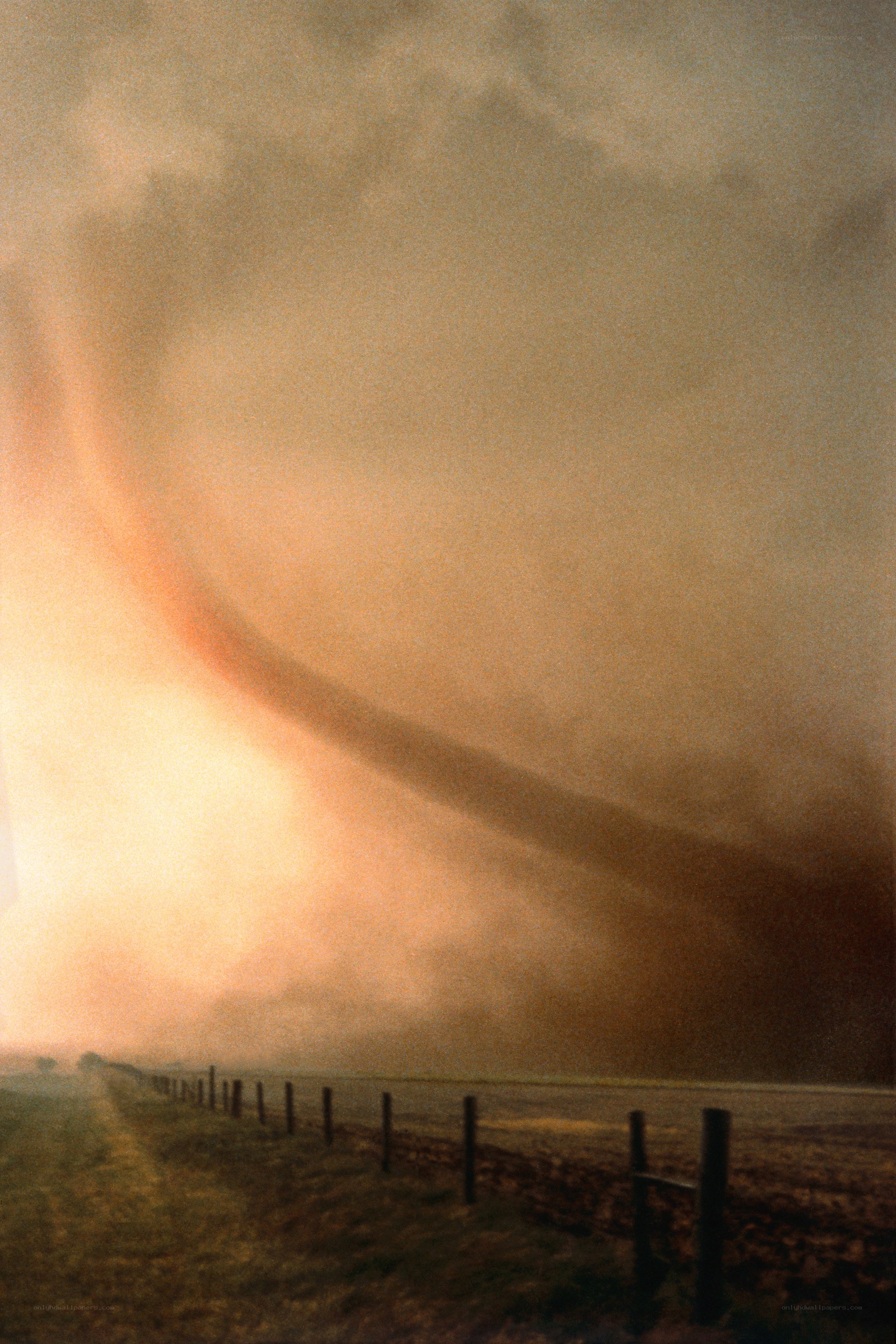Tornado over rural field