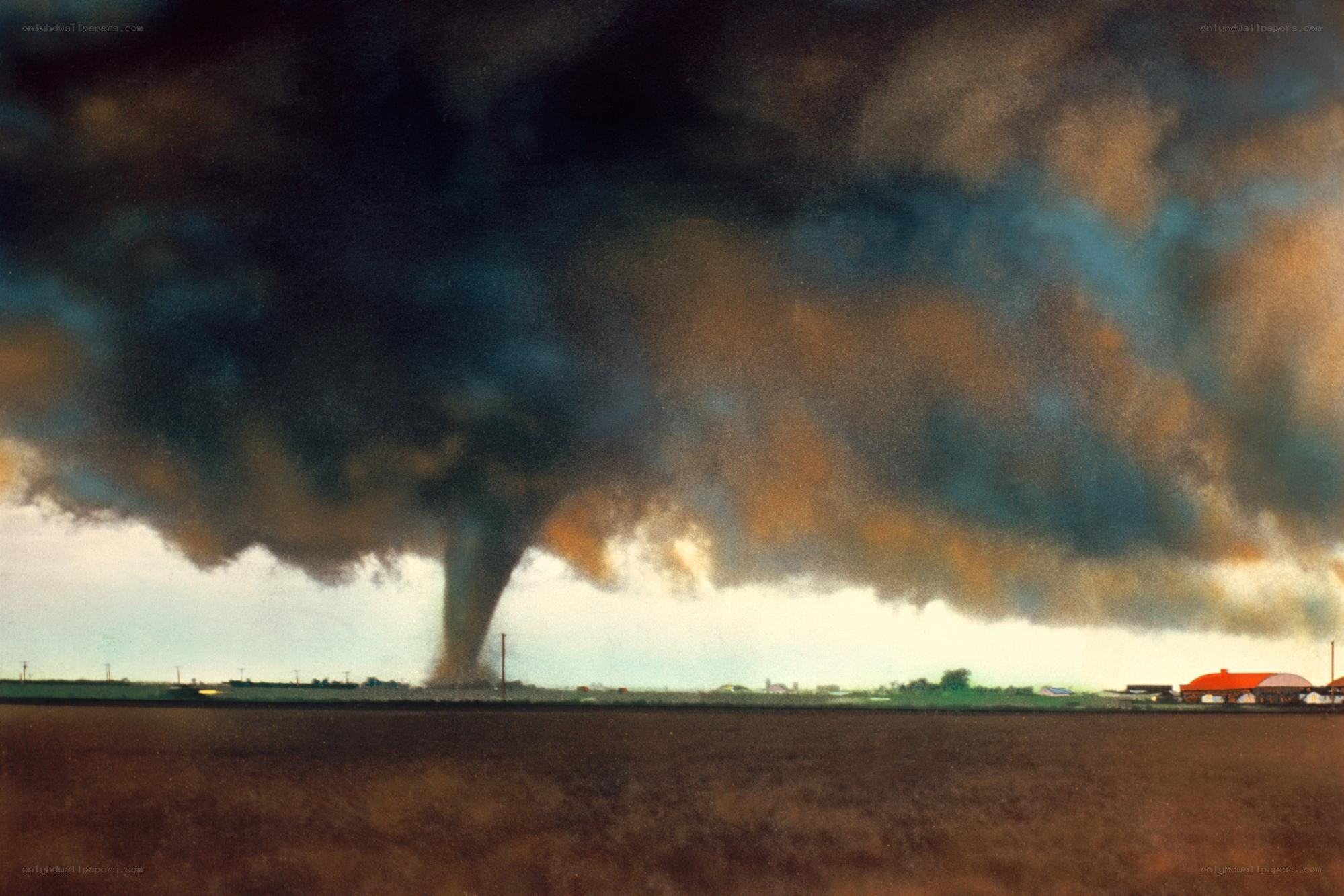 Tornado over rural landscape