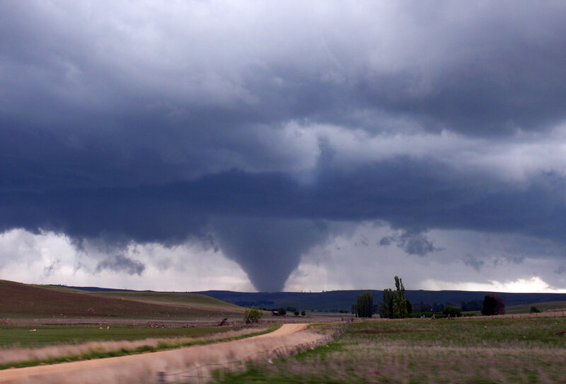 Tornado over rural landscape