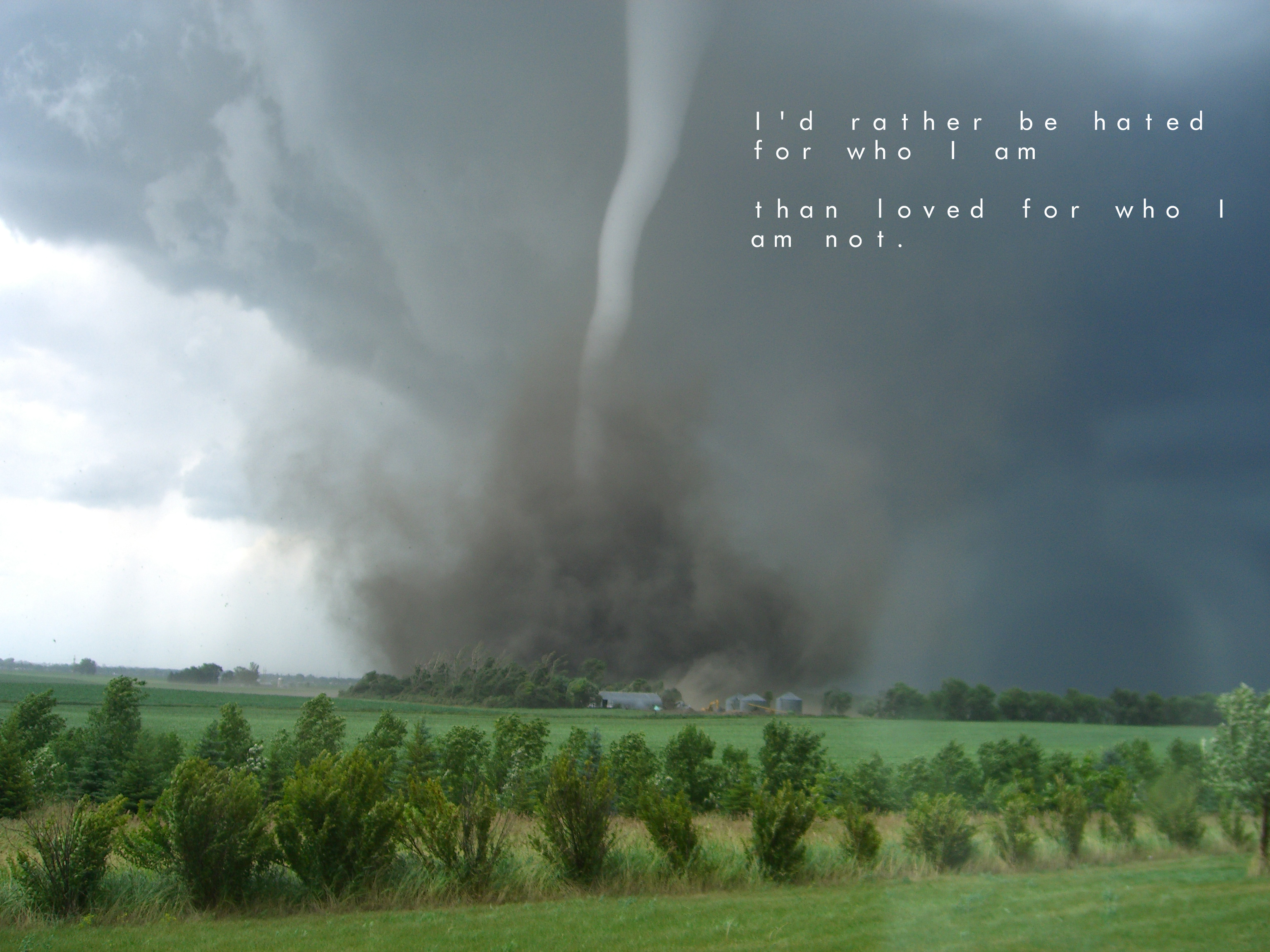 Tornado over rural landscape