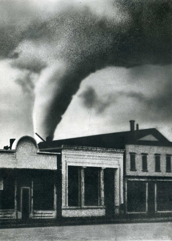 Tornado over town buildings