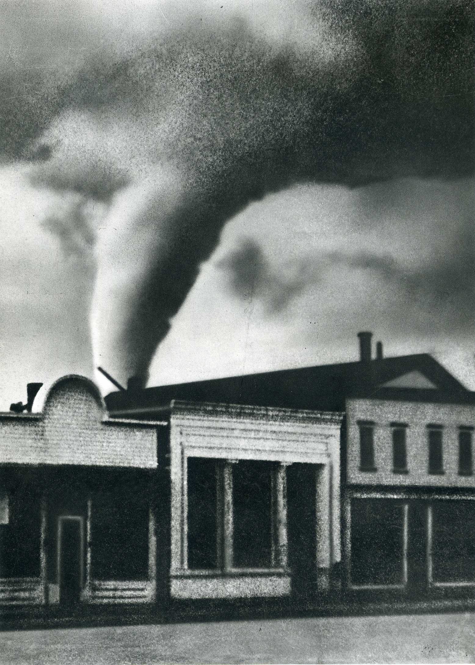 Tornado over town buildings