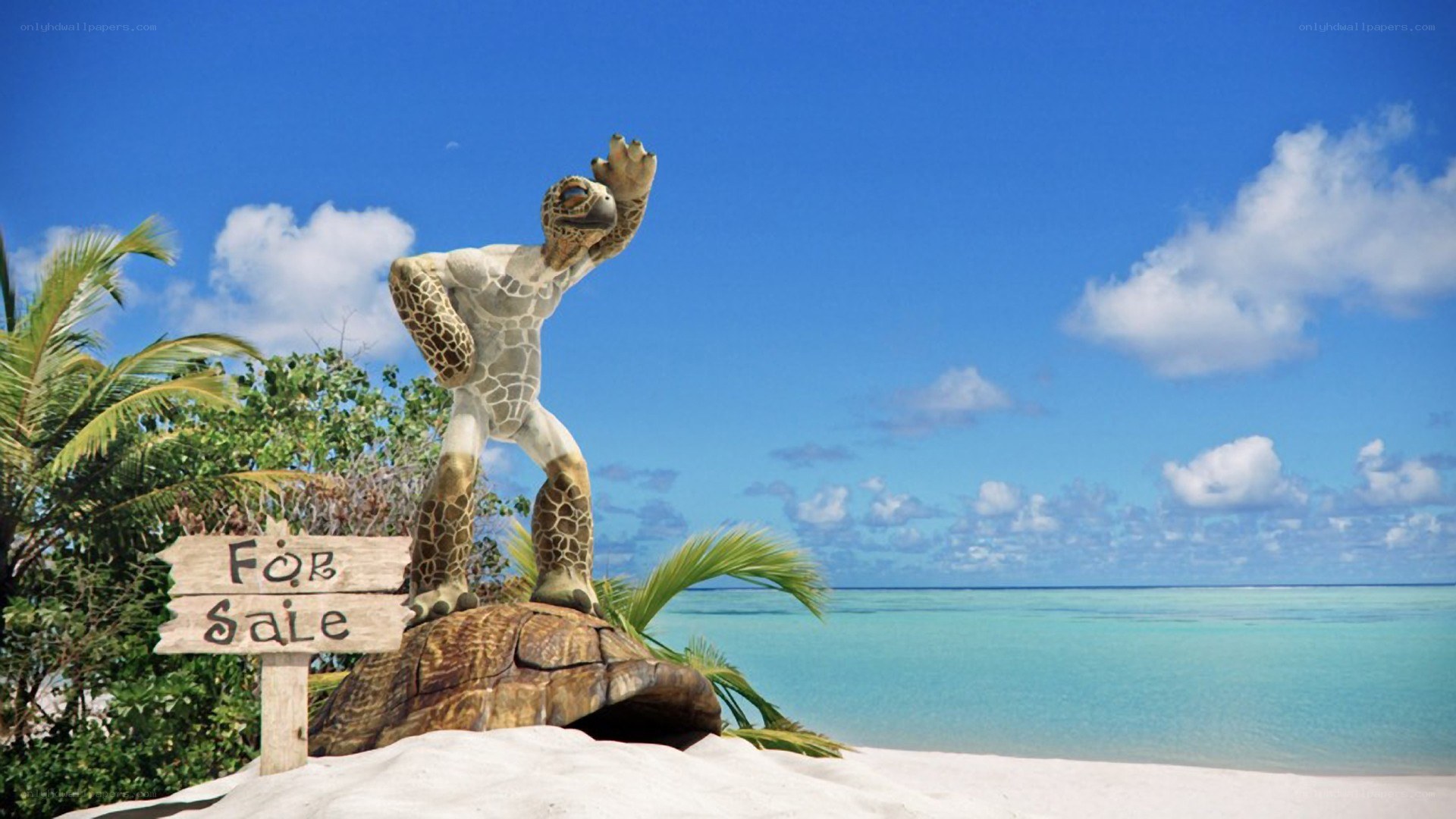tortoise statue on tropical beach