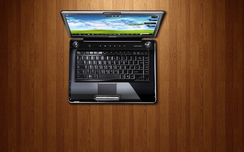Toshiba laptop on wooden surface