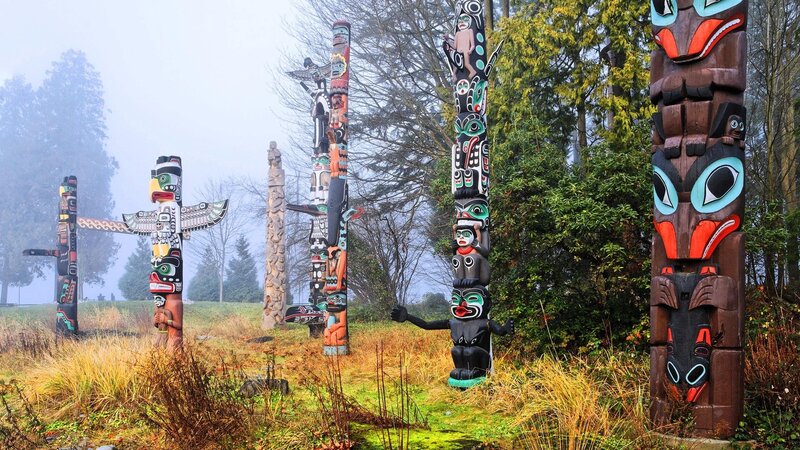 Totem Poles in Forest — Brown