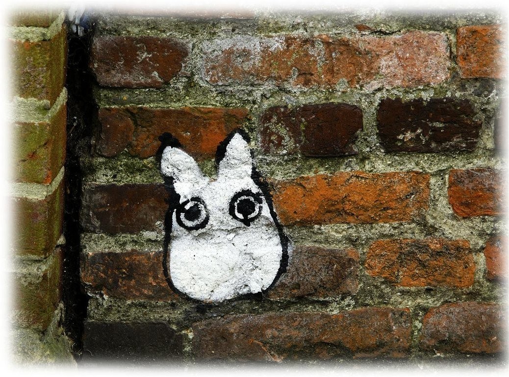 Totoro graffiti on brick wall
