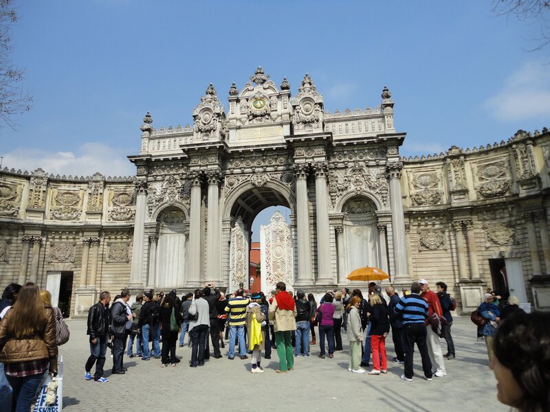 Tourists at a historic archway
