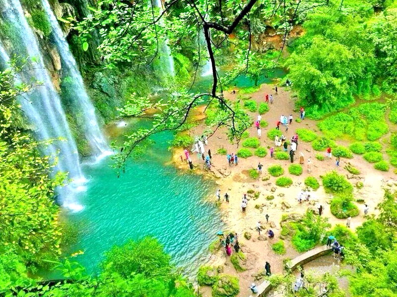 Tourists at Waterfall — Green, Serene, Afternoon
