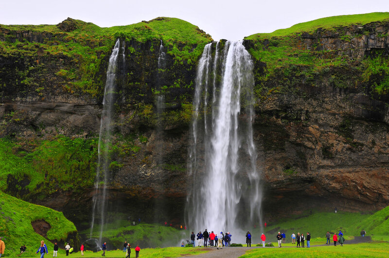 Tourists at Waterfall — Green, Serene