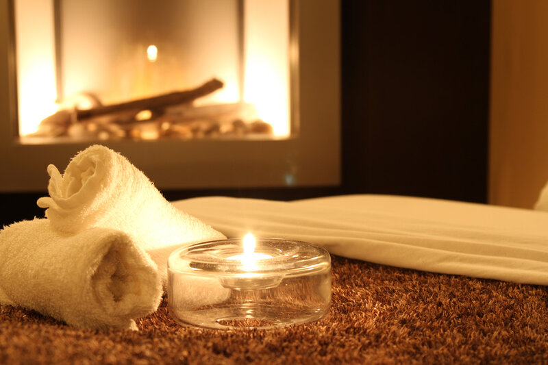 Towels and Candle by Fireplace