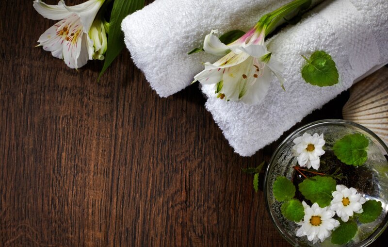 Towels and Flowers on Wood