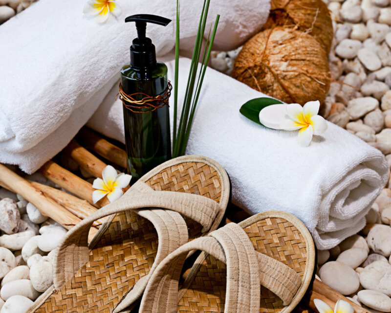 Towels and Sandals on Pebbles