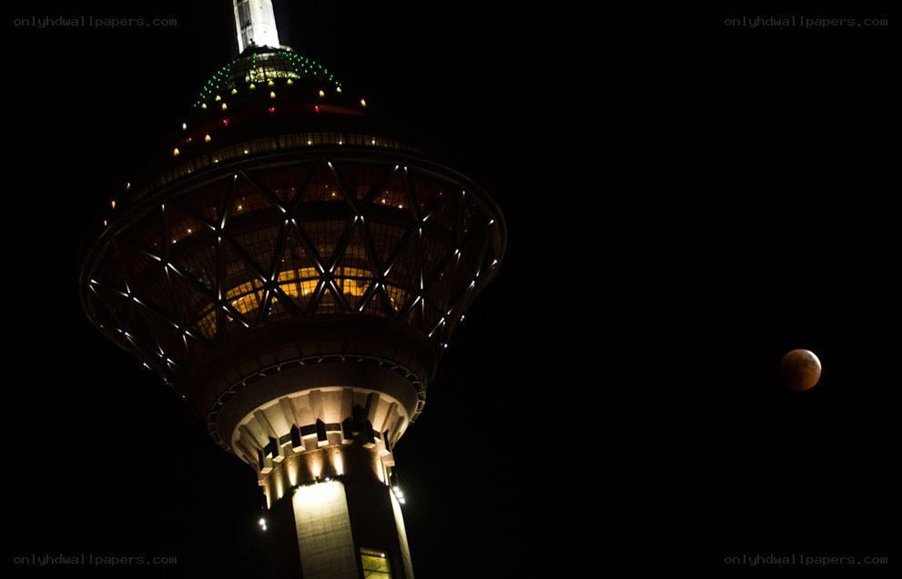 Tower and moon at night