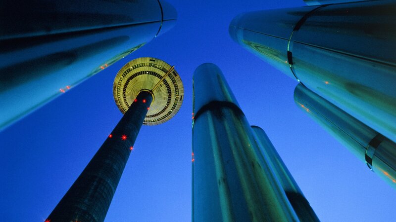 tower at dusk with modern structures