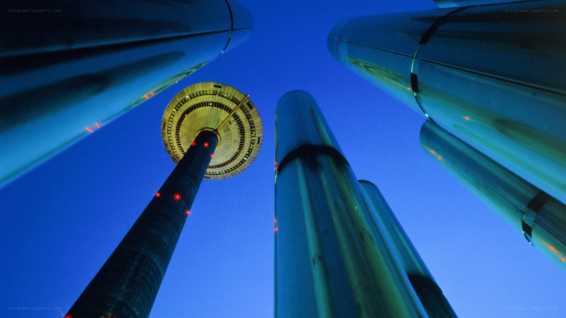 tower at dusk with modern structures