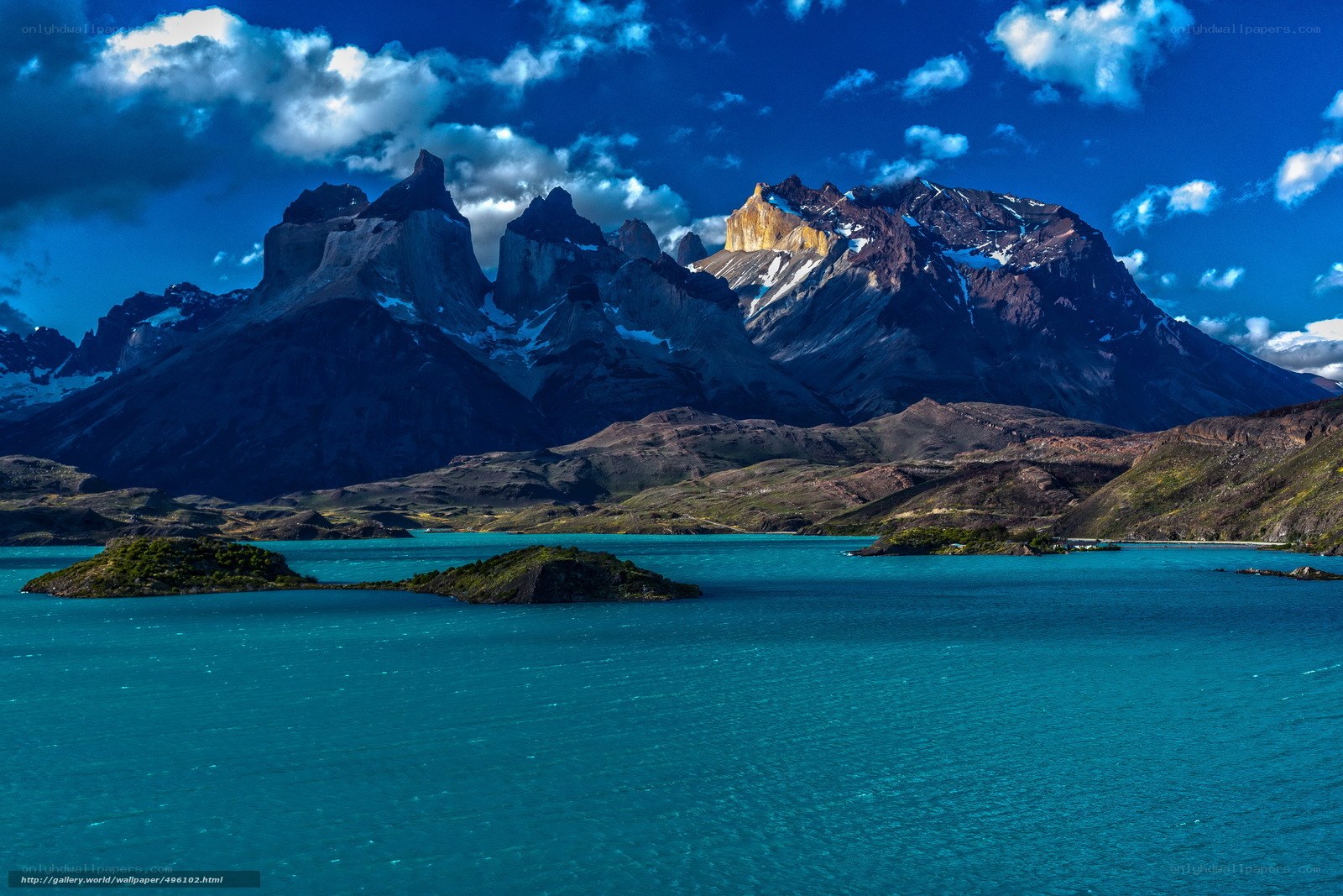 Towering peaks over turquoise lake