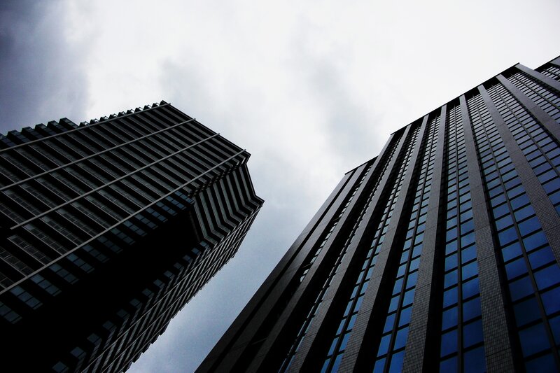 Towering skyscrapers under cloudy sky