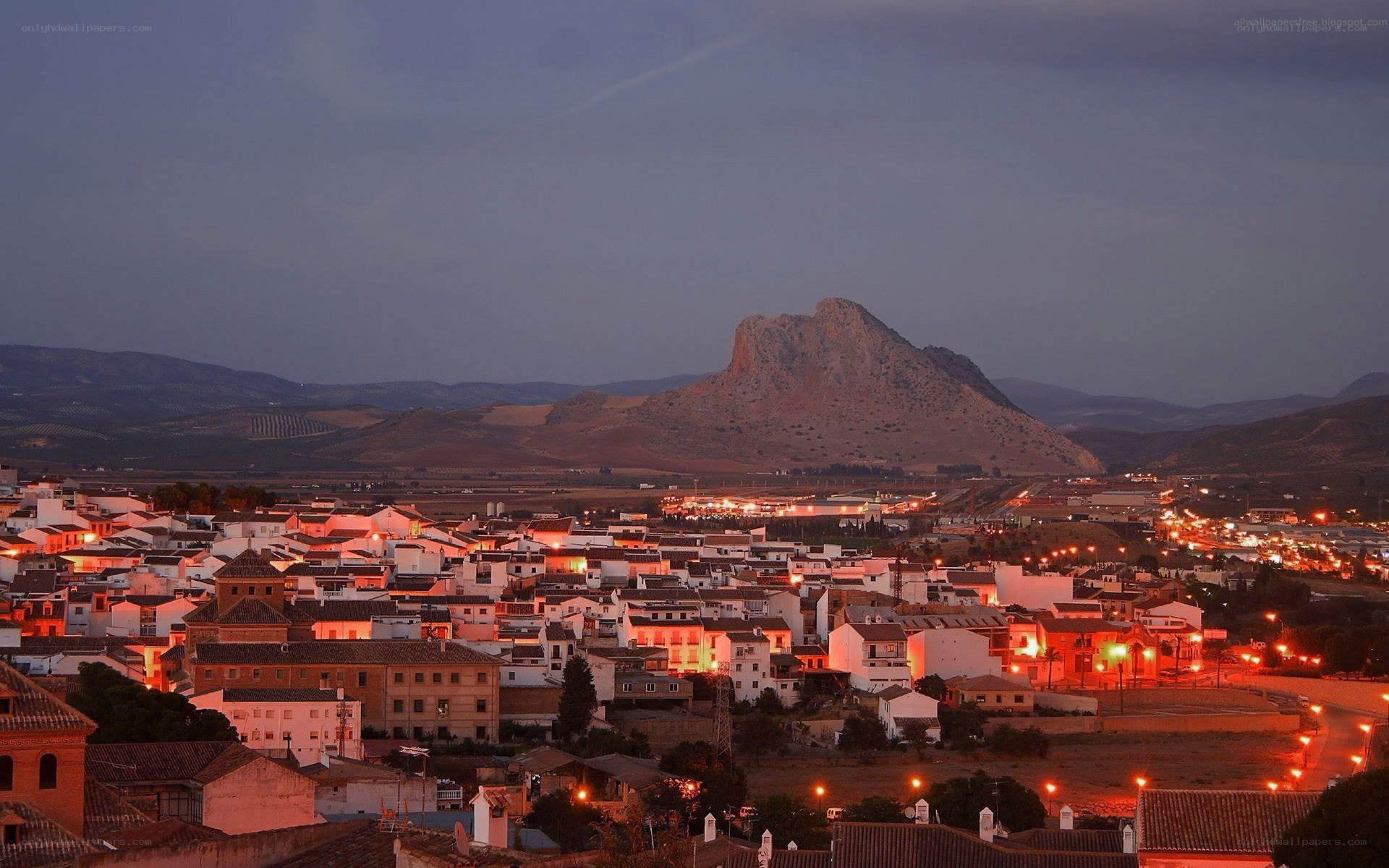 town at dusk with mountain