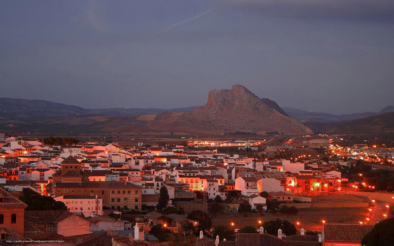 town at dusk with mountain