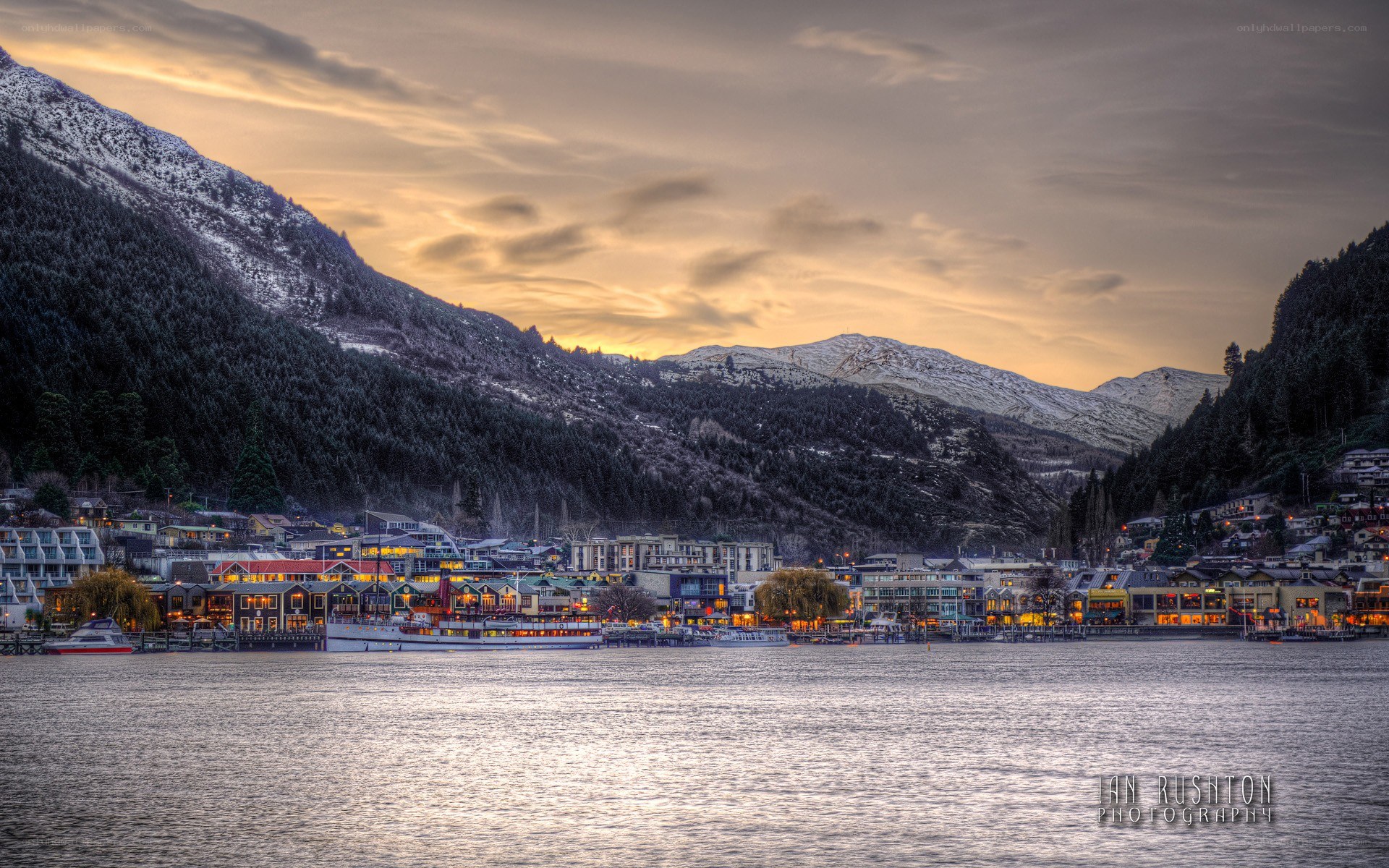 Town by a lake at sunset