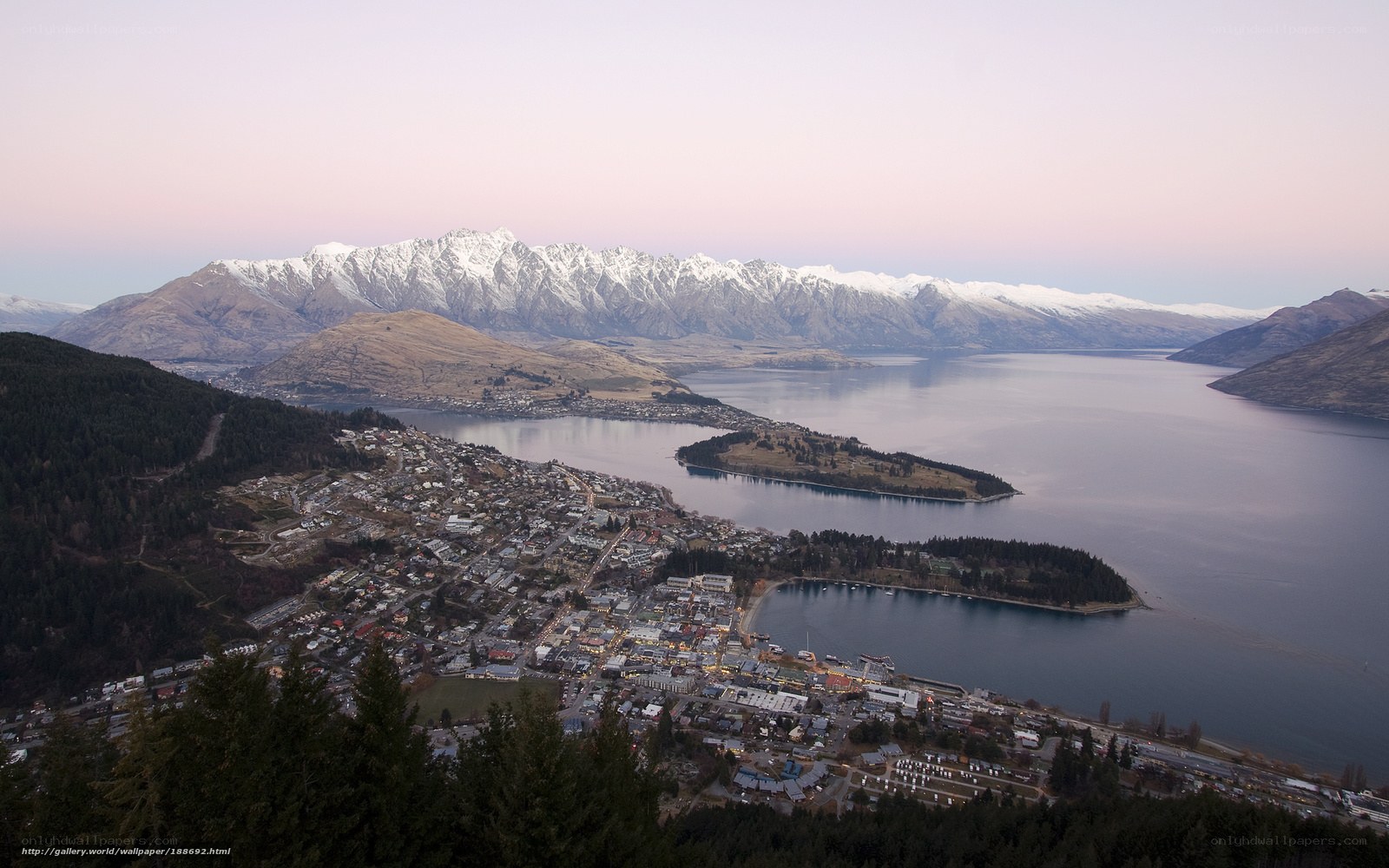 Town by a lake with mountains