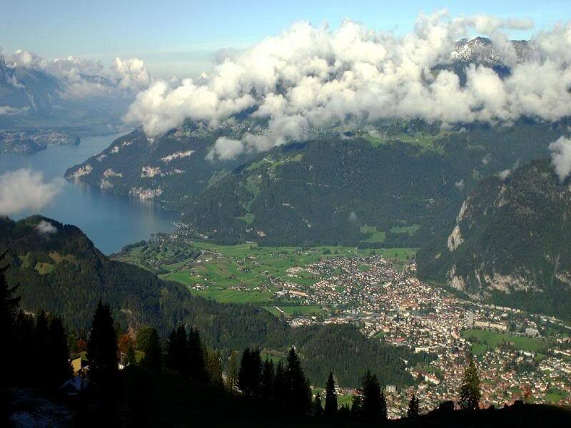 Town in Mountain Valley — Green, Serene, Afternoon, Photograph