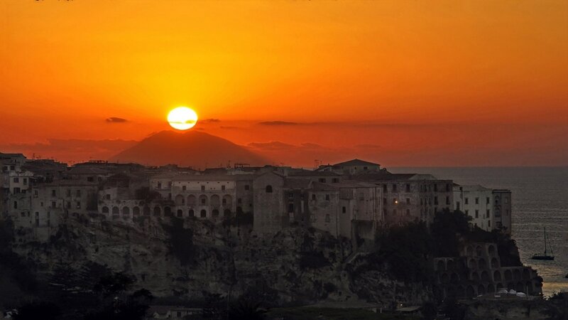 Town on a Cliff at Sunset