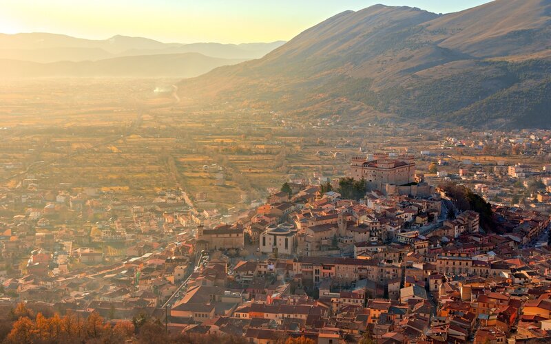 Town on a Hill at Sunset — Orange