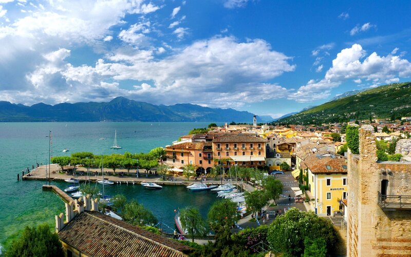 Town on Lake Shore — Blue, Serene, Afternoon, Photograph, Buildings, Boats