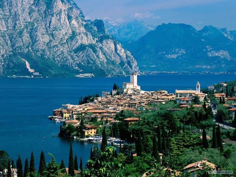 Town on Lake Shore — Blue, Serene, Afternoon, Photograph, Mountains, Castle