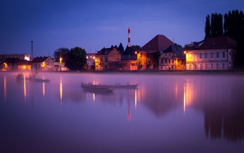 Town on Riverbank at Dusk