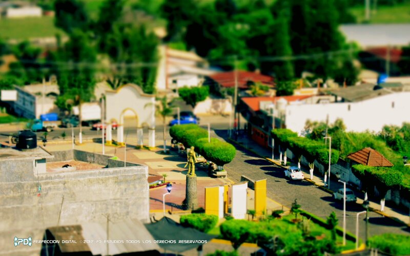 town square with statue and arch