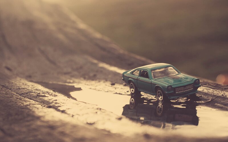 Toy car in a puddle